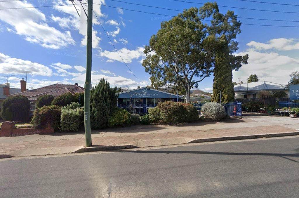 The nursery seen from across Phillip Street, behind a clipped hedge